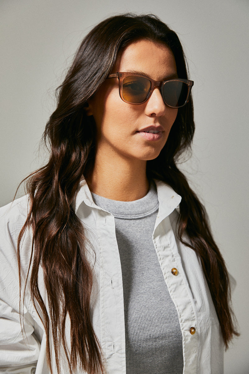 Female model wearing brown prescription sunglasses