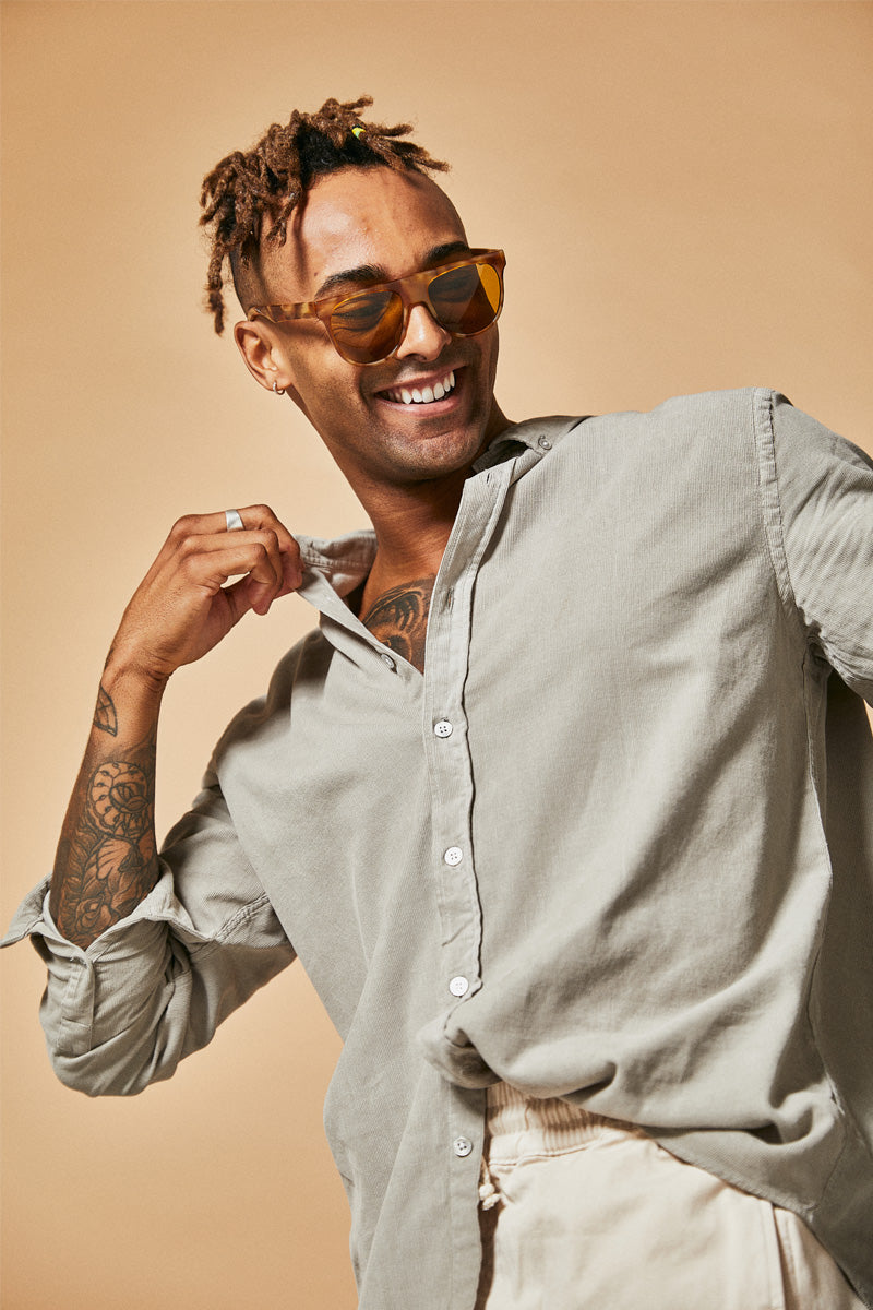 Male model wearing orange prescription sunglasses from Ozeano Vision