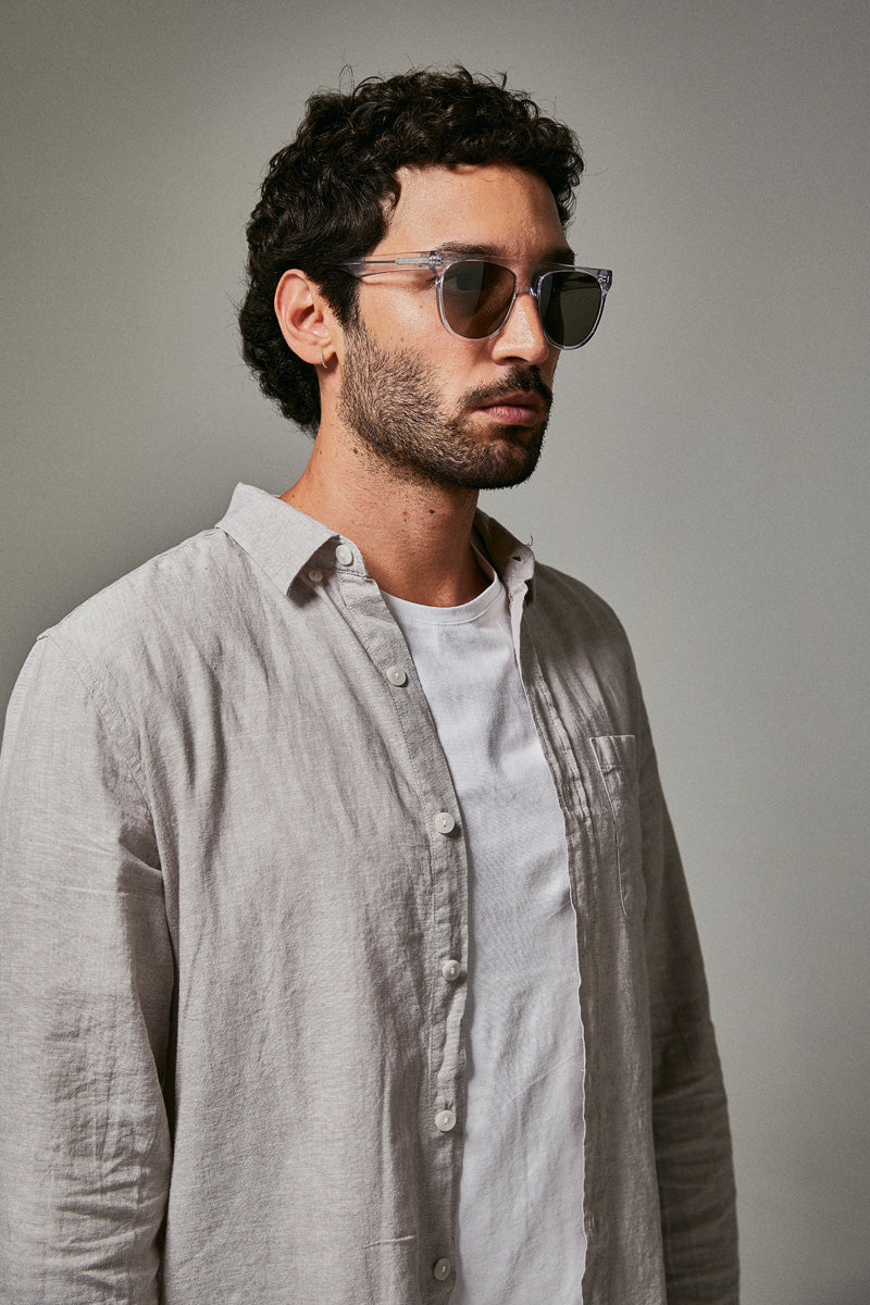 Male model wearing translucent prescription sunglasses
