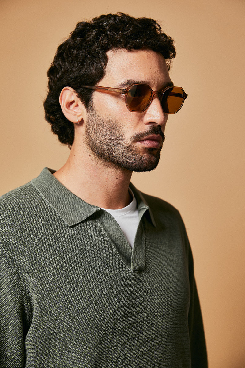 Male model wearing brown polarised sunglasses from Ozeano Vision