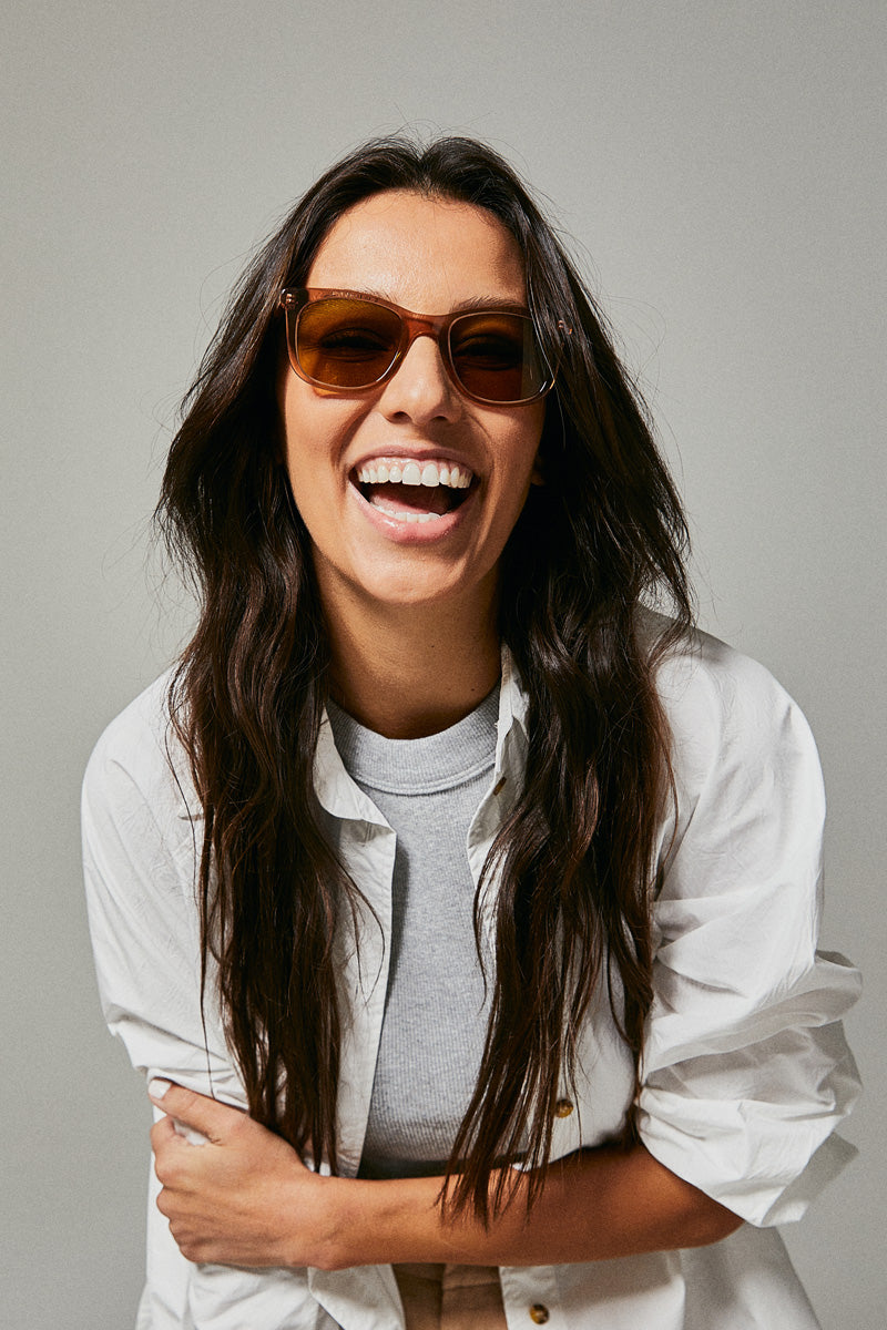 Female model wearing brown prescription sunglasses