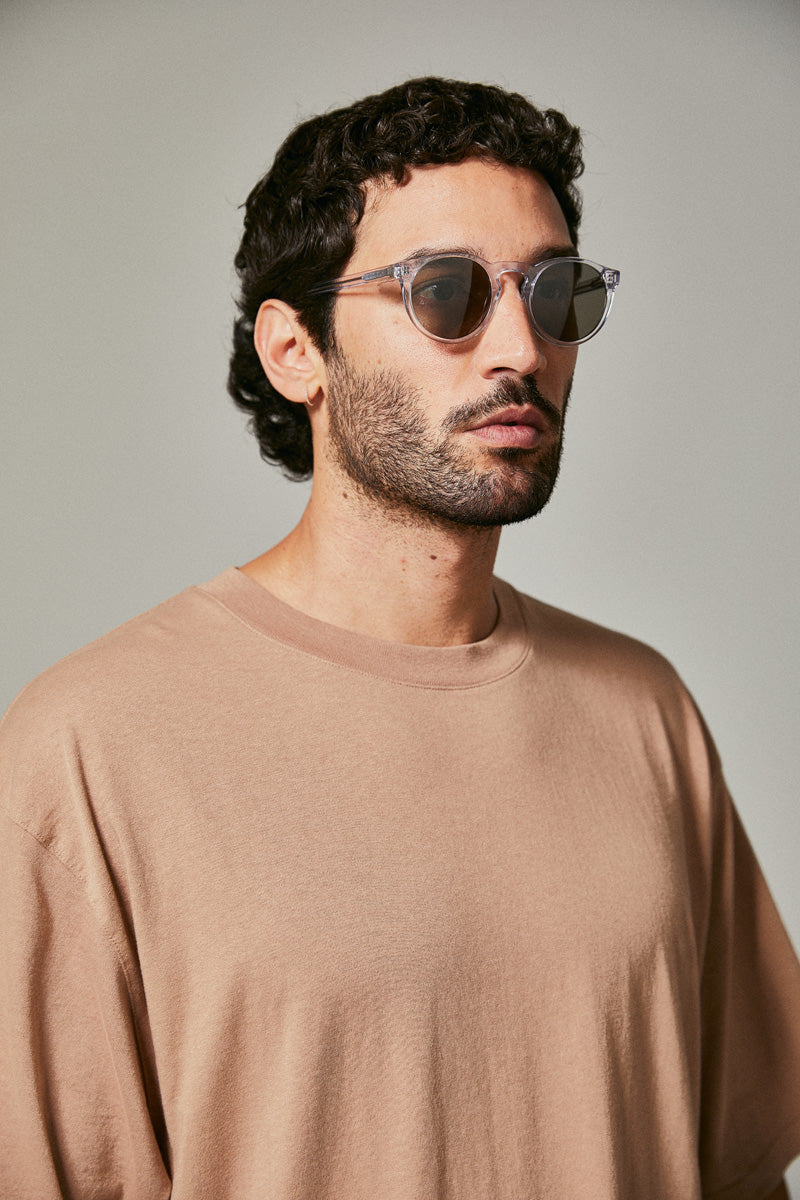 Male model wearing translucent prescription sunglasses